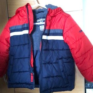 A toddler winter coat with hood .